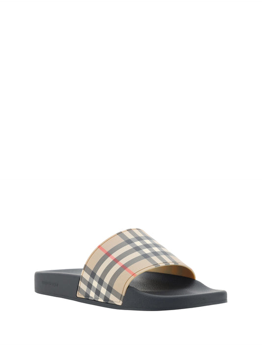 Burberry Brown Rubber Slides Sandals $669.00 Burberry Luzworld