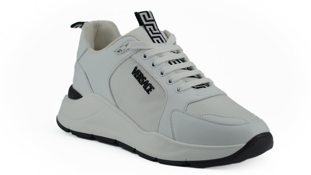 Gray sneaker with black sole on a white background