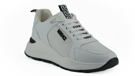 Gray sneaker with black sole on a white background