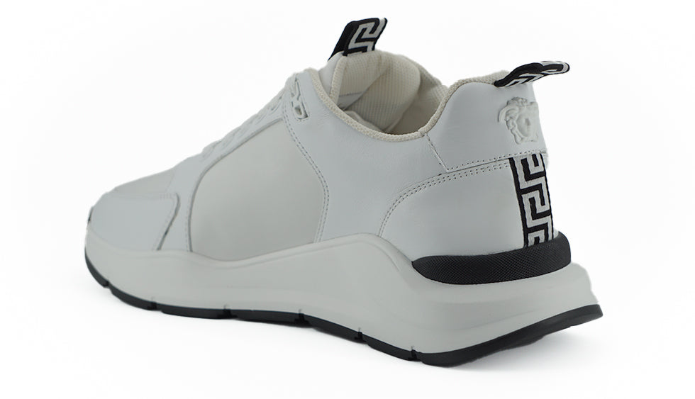 Gray sneaker with black accents on a white background