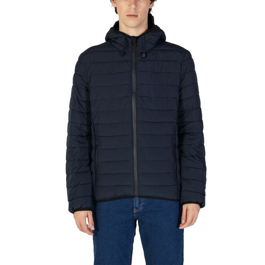 Person wearing a navy blue puffer jacket on a white background