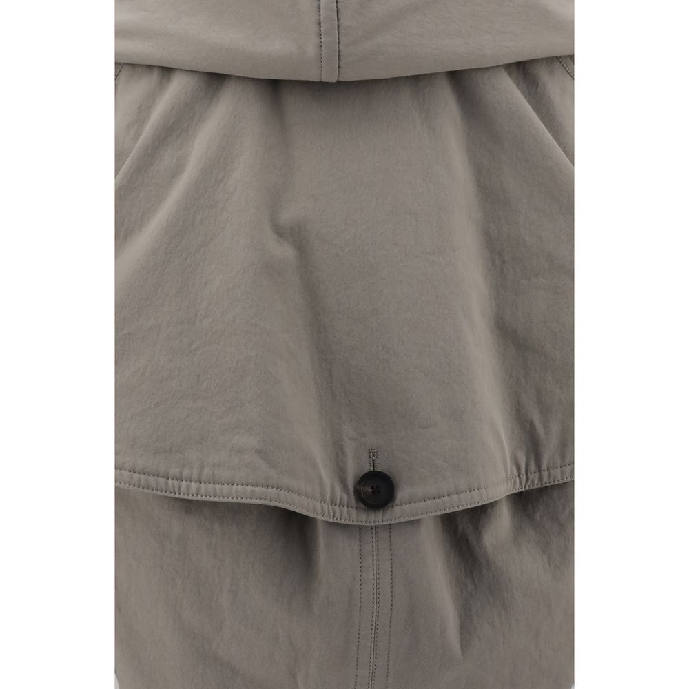 Close-up of a gray jacket with a button on a white background