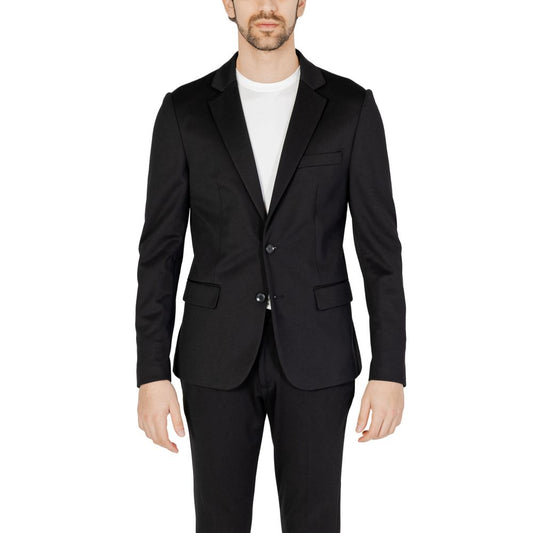 Black suit jacket worn by a person on a white background